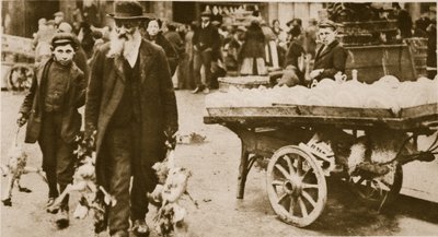 A Jewish old man and his grandson carrying some fowls from Wentworth Street, Stepney by English Photographer